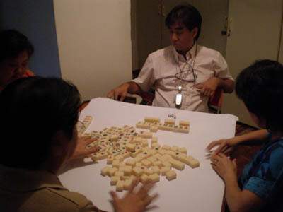 Papa hard at work... playing Mahjong